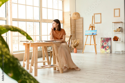 Young female artist drawing...