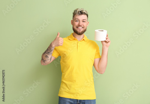 Young man with toilet paper...