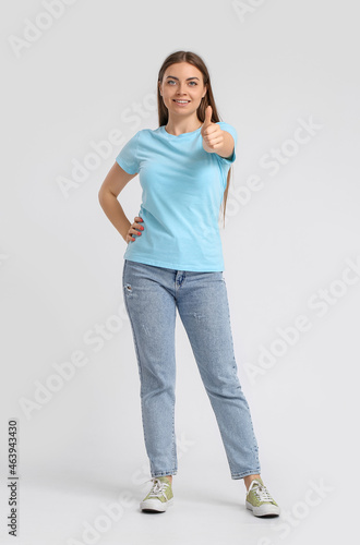 Young woman in blue t-shirt...