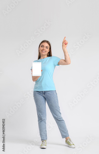 Pretty young woman with tab...