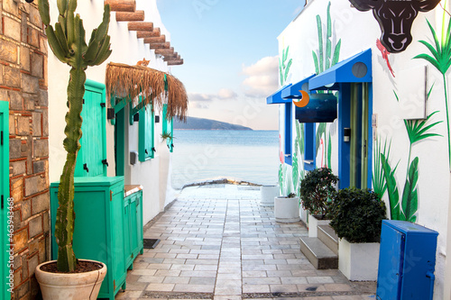 Wide angle shot of narrow streets at sunrise in Bodrum, Mugla, Turkey. Tourism and leisure concept. photo
