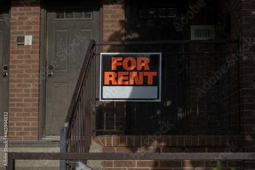 Photography Sign for rent at the front of a residential house