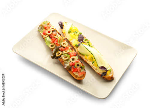 Plate with tasty vegetarian bruschettas on white background
