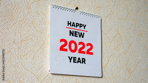 Close-up of the title page of a calendar 2022 hanging on the wall