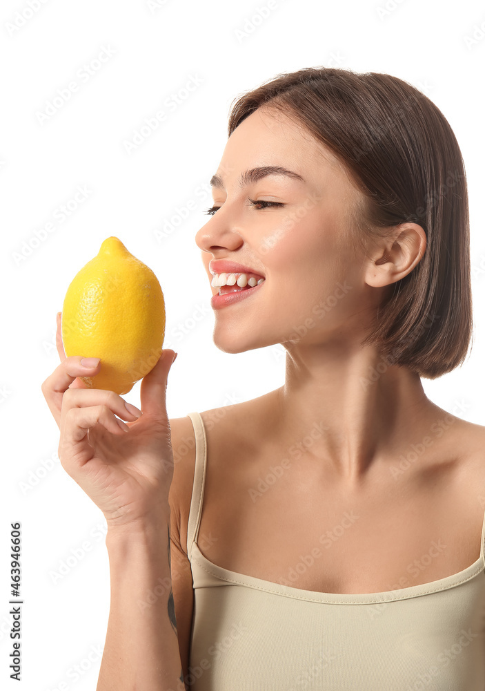 Young woman with lemon on white background. Vegan Day Young woman with lemon on white background. Vegan Day