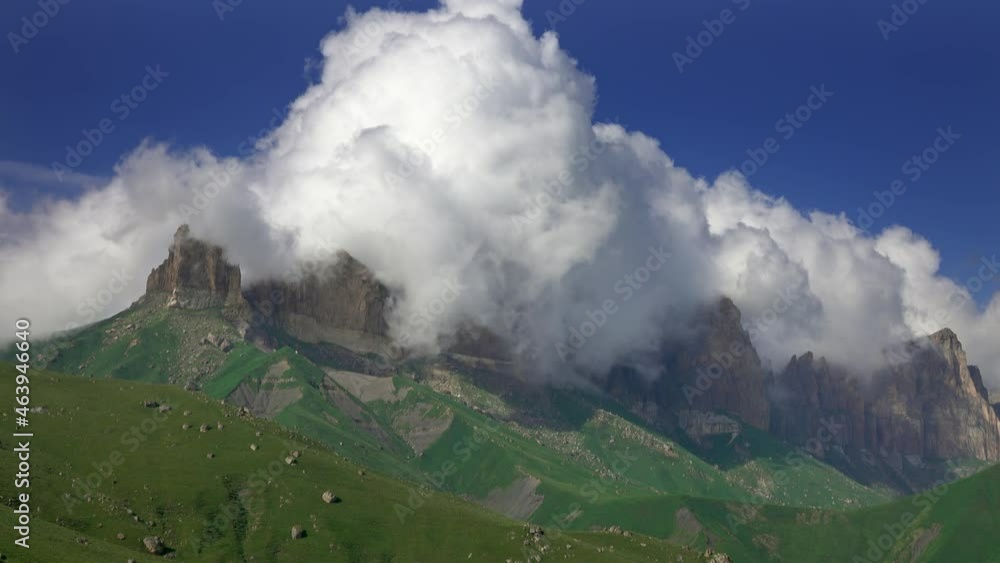 Caucasus mountains under epic moving and falling down clouds, Kabardino-Balkaria, Russia, 4k Caucasus mountains under epic moving and falling down clouds, Kabardino-Balkaria, Russia, 4k