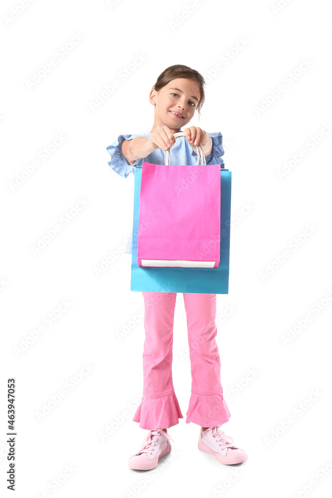 Little girl with Black Friday shopping bags on white background Little girl with Black Friday shopping bags on white background