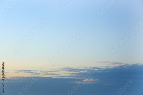 Clear blue sky with faint h...