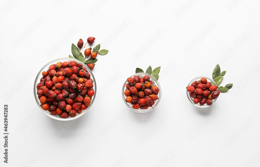 Bowls with fresh rose hip berries on white background - obrazy, fototapety, plakaty 