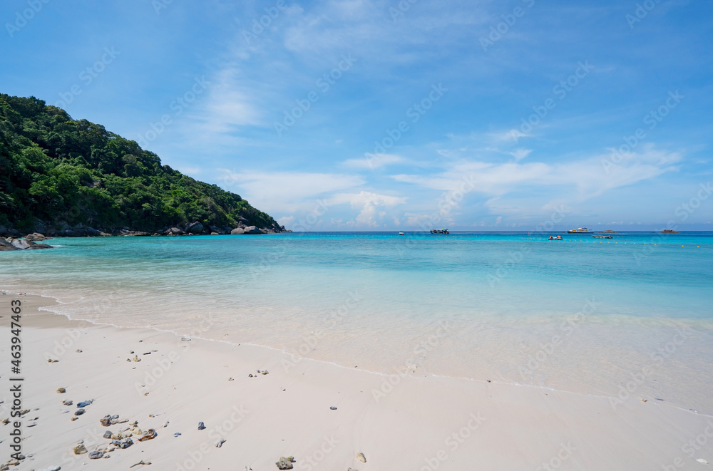 Beautiful beach and tropical sea with wave crashing on sandy shore Small island archipelago at Similan national park Thailand travel and tour concept Amazing island in Phang nga Thailand