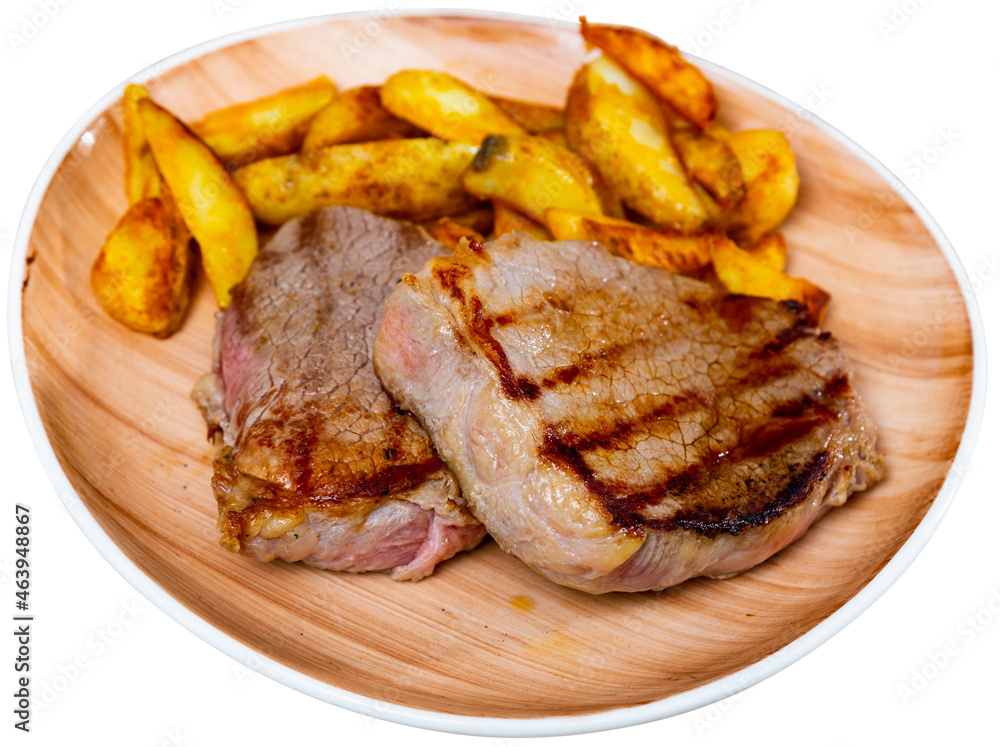 Portion of potatoes with veal steak, popular dish of eastern Europe. Isolated over white background