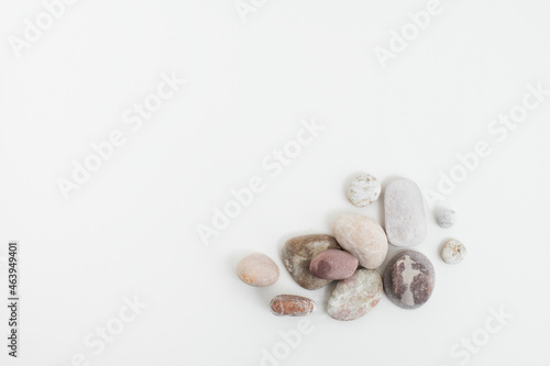 Marble zen stones stacked on white background in mindfulness concept
