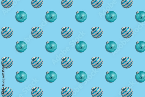 pattern of shiny blue christmas spheres, on a light blue background