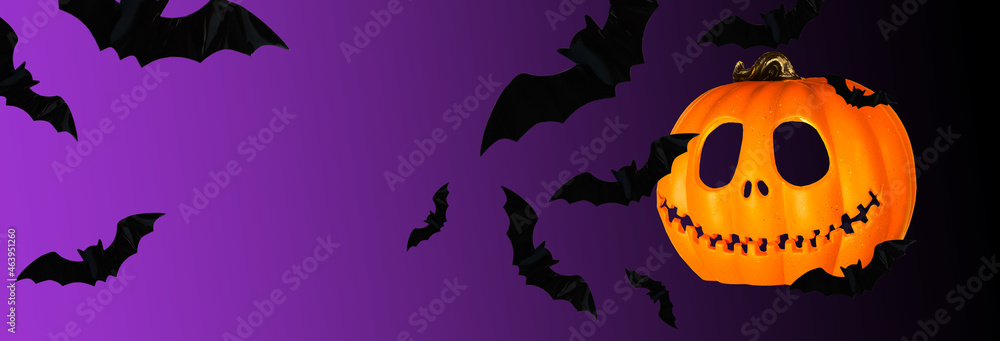 Black flying bats and on a black purple background, halloween background banner