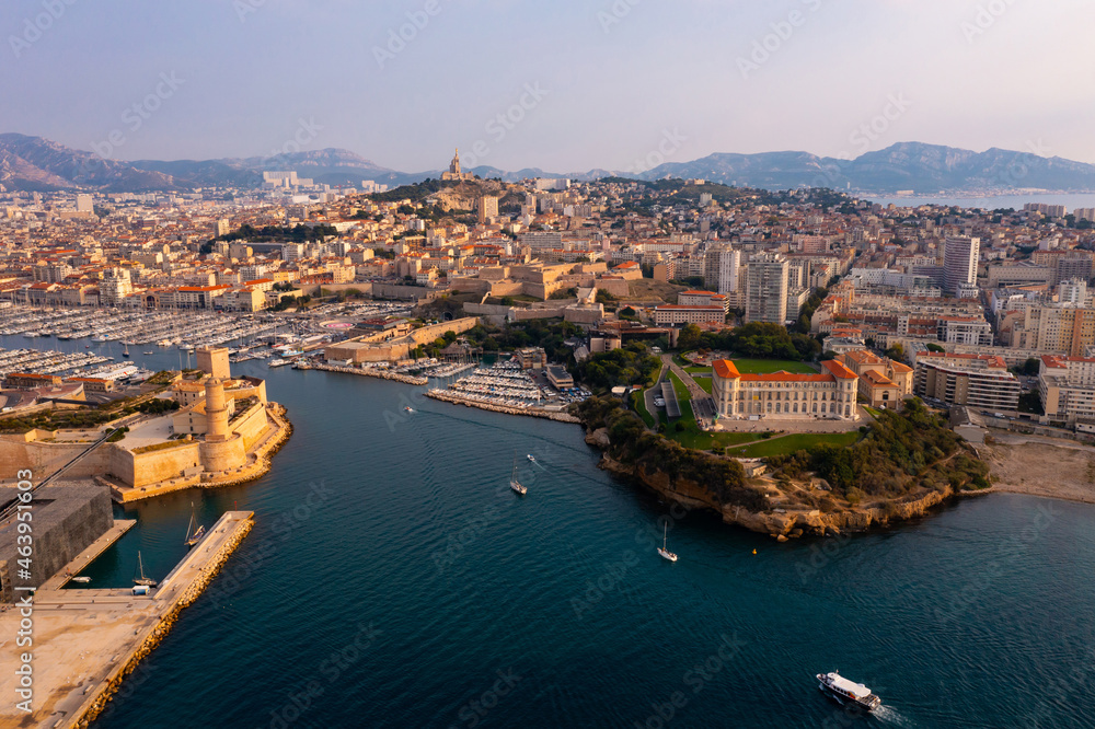 Aerial panoramic view of seaside areas of French city of Marseille on Mediterranean coast overlooking ancient Fort Saint-Jean 