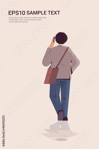 businessman in formal wear standing back to camera rear view of elegant business man posing