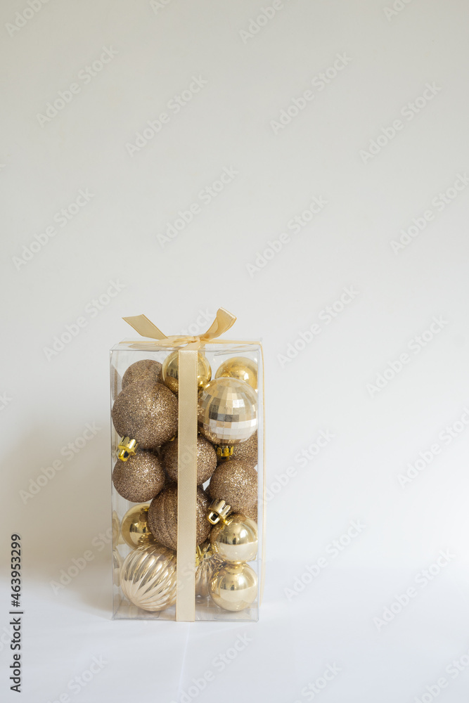 Vertical close-up of Christmas ball box with white background and copy space.