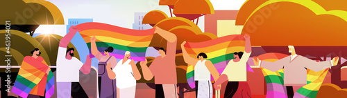mix race people holding lgbt rainbow flags gay lesbian love parade pride festival transgender love concept