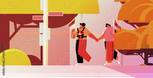 mix race female parents walking with little child lesbian family transgender love LGBT community concept