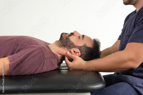 Close-up of a patient receiving a neck massage from the physiotherapist