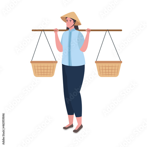 woman vietnamese carrying on shoulders baskets