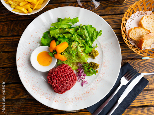 Wallpaper Mural Tartar beef with a quail egg and arugula served on plate. Modern French cuisine Torontodigital.ca