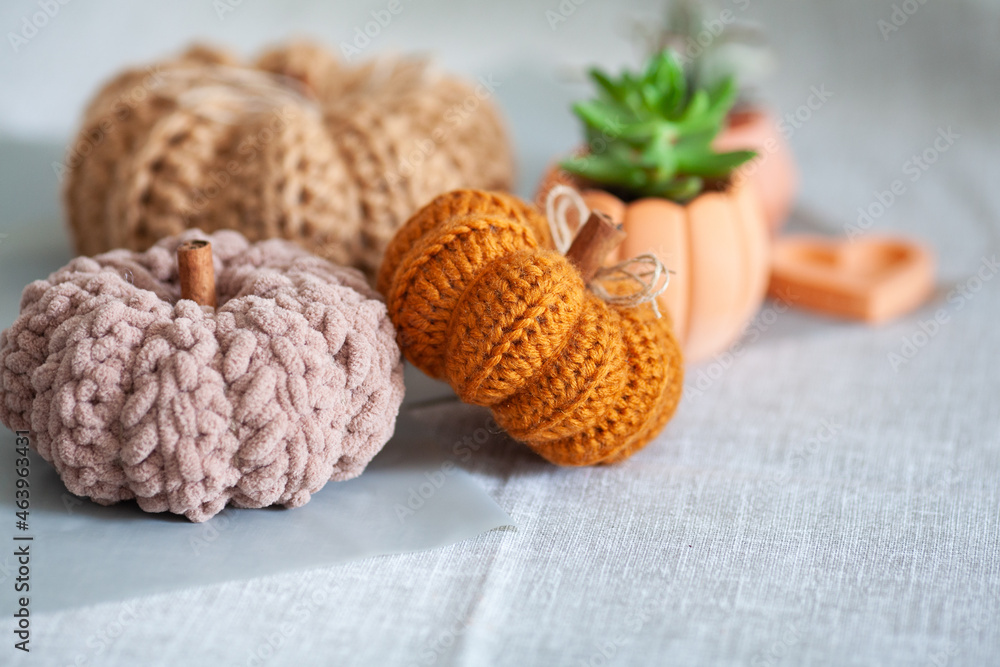 Handemade cozy fabric pumpkins for autumn decoration. knitted pumpkins for the holiday halloween, home decor Handemade cozy fabric pumpkins for autumn decoration. knitted pumpkins for the holiday halloween, home decor