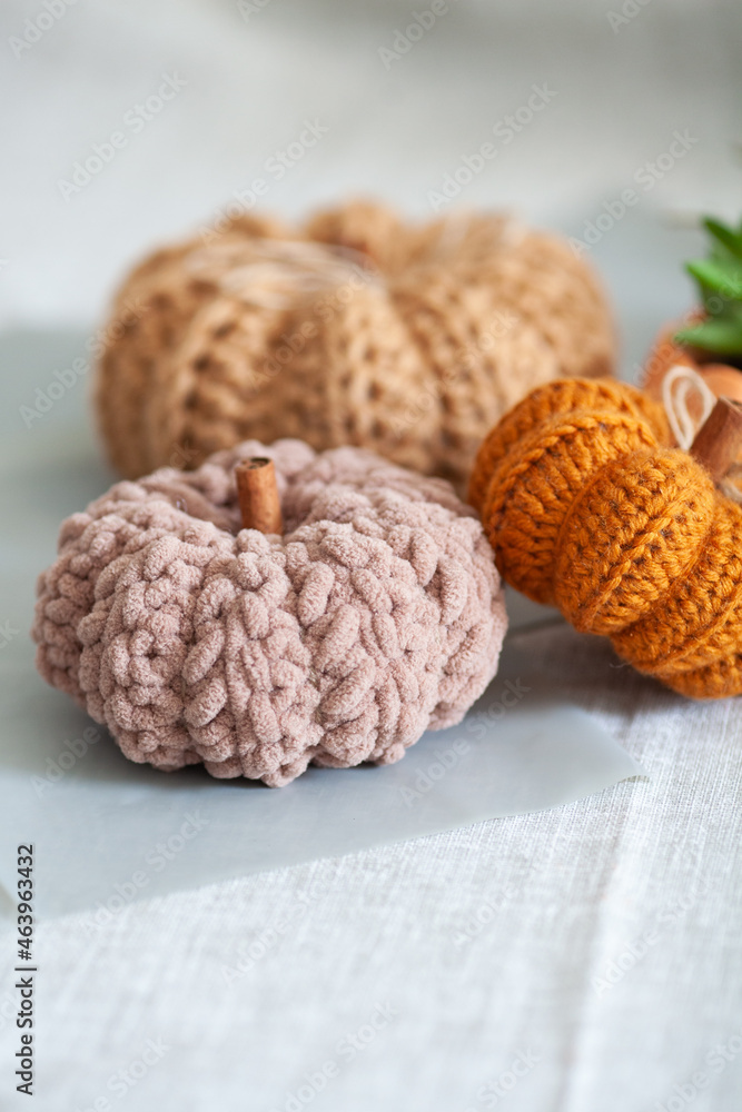 Handemade cozy fabric pumpkins for autumn decoration. knitted pumpkins for the holiday halloween, home decor Handemade cozy fabric pumpkins for autumn decoration. knitted pumpkins for the holiday halloween, home decor