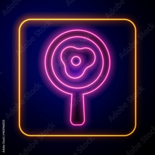 Glowing neon Fried eggs on frying pan icon isolated on black background. Fry or roast food symbol. Vector