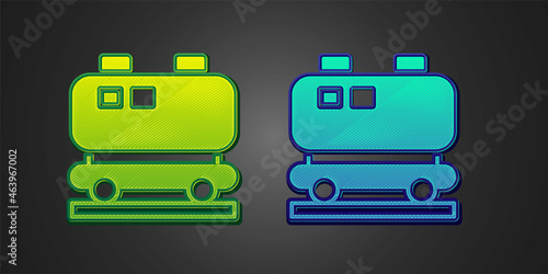 Green and blue Oil railway cistern icon isolated on black background. Train oil tank on railway car. Rail freight. Oil industry. Vector