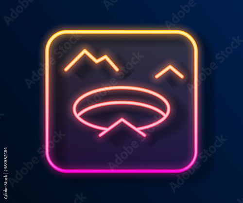 Glowing neon line Winter fishing icon isolated on black background. Round ice frame. Hole in ice. Vector