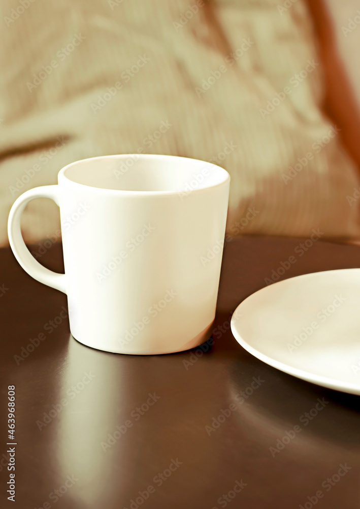 a light mug on a dark table