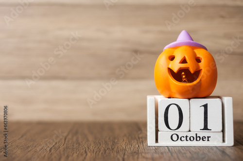 Happy Halloween day with Jack O lantern pumpkin and 1 October calendar. Trick or Threat, Hello October, fall autumn, Festive, party and holiday concept