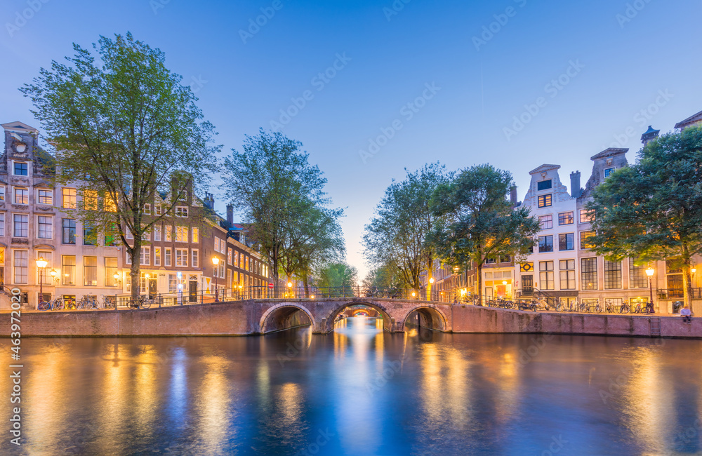 Amsterdam. Panoramic view of the historic city center of Amsterdam. Traditional houses  and bridges of Amsterdam.  A European travel to a historic town. Europe, Netherlands, Holland, Amsterdam.