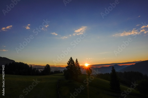 sunrise with colorful sky and dark landscape in the mountains