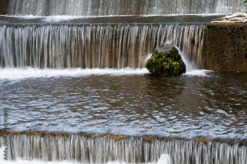 mossy rock in waterfall