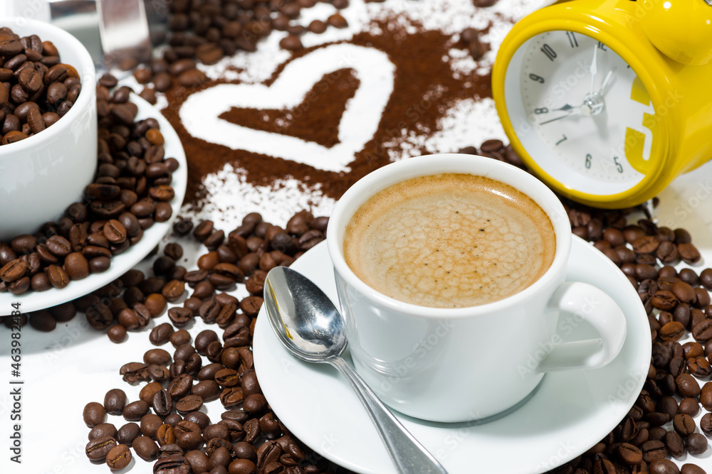 cup of espresso alarm clock and coffee beans conceptual photography, top view cup of espresso alarm clock and coffee beans conceptual photography, top view