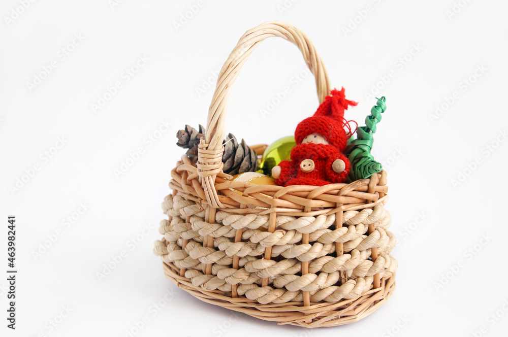 Christmas basket with toys on a white background Christmas basket with toys on a white background