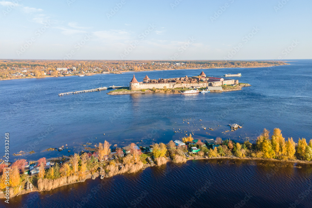 Russia, Saint Petersburg, 09.10.2021. Oreshek Fortress is an ancient Russian fortress on Orekhov Island at the source of the Neva River at autumn. Petrokrepost Bay aerial view.