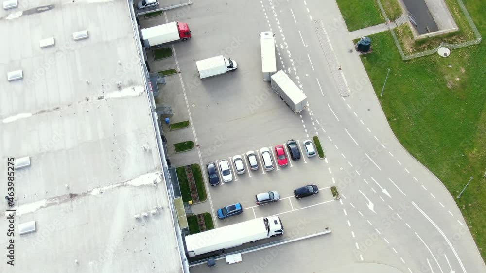 Aerial view of modern storage warehouse. Logistics center in industrial city zone from drone view. Background texture concept. Aerial view of modern storage warehouse. Logistics center in industrial city zone from drone view. Background texture concept.