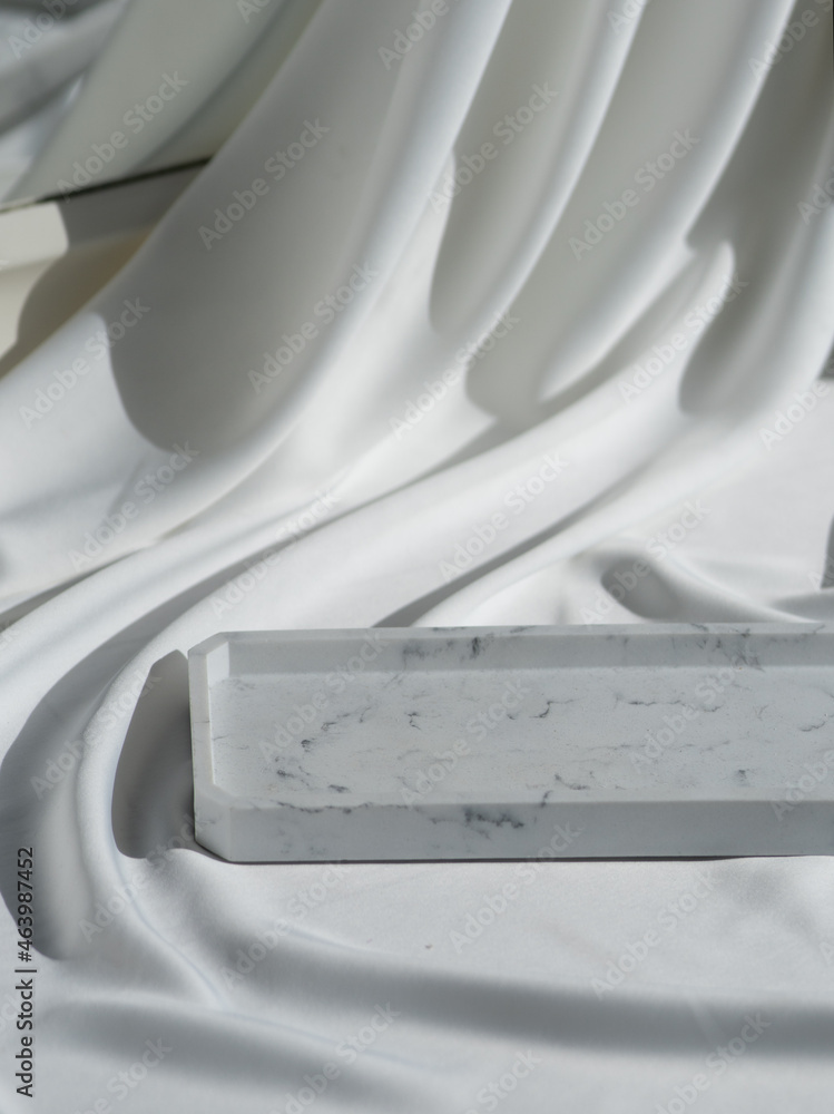 Beautiful background with a satin ornament and a marble tray with space for your product
Beautiful background with a satin ornament and a marble tray with space for your product