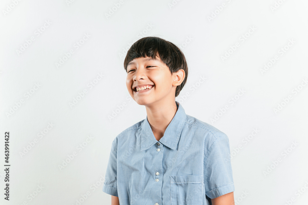 Portrait of adorable young happy smiling mixed race boy looking at camera wearing a casual school look in a good mood, carefree childhood. Isolated on white background for copy space and graphics Portrait of adorable young happy smiling mixed race boy looking at camera wearing a casual school look in a good mood, carefree childhood. Isolated on white background for copy space and graphics