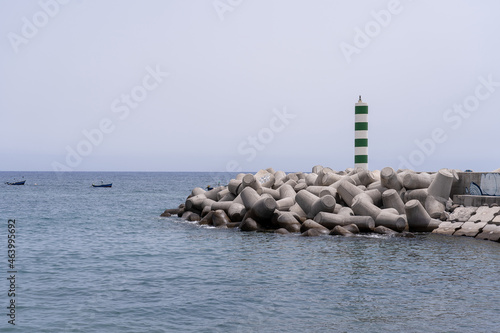 Bild auf Leinwand Lighthouse on an artificial breakwater