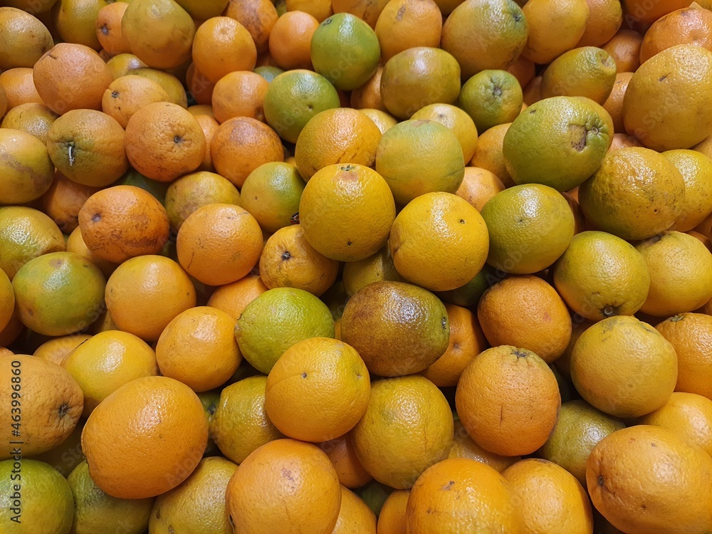 Many oranges on the market, backgrounds and textures. Many oranges on the market, backgrounds and textures.