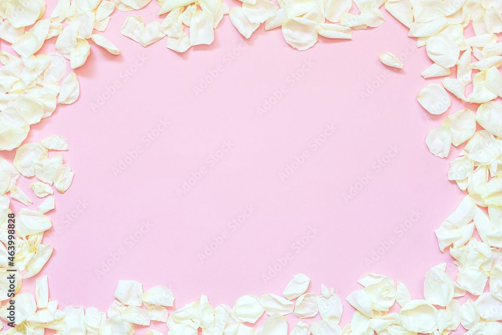 Flower composition. Rose flower petals on pastel pink background.  Concept: Mother's Day, Valentine's Day, Wedding, Birthday. Flat lay, top view, copy space for text