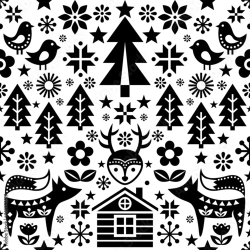 Scandinavian Christmas black and white folk art seamless vector pattern wtih reindeer, birds, snowflakes and flowers, festive Nordic decoration

