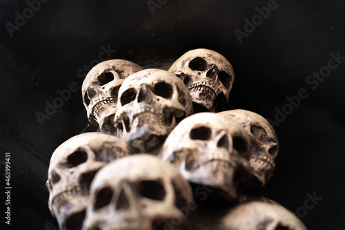 Skull Halloween Background Many People Skulls Stand on top of each other. Mystic creepy concept. Abstract nightmare occult memorial