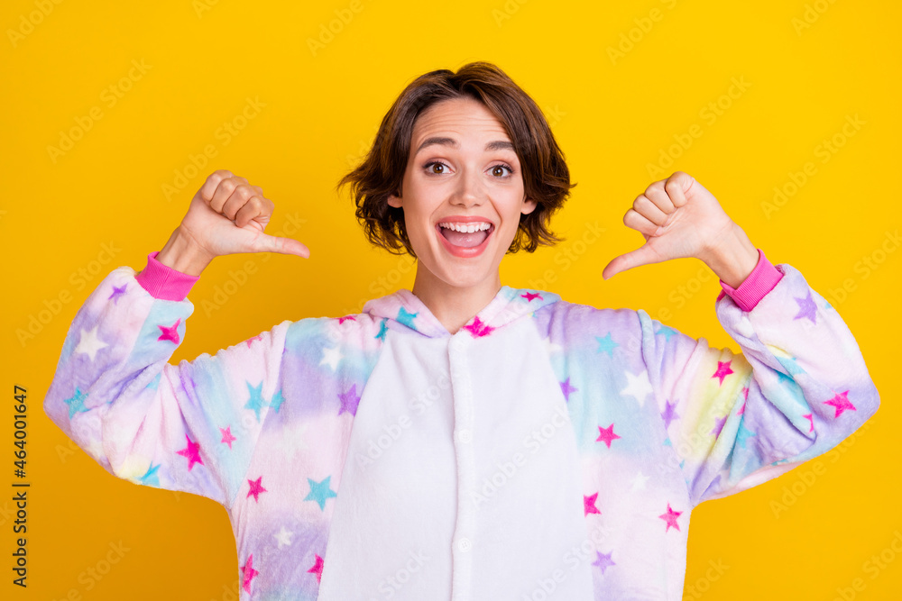 Photo of young cheerful girl happy positive smile point thumb herself proud choice victory isolated over yellow color background Photo of young cheerful girl happy positive smile point thumb herself proud choice victory isolated over yellow color background
