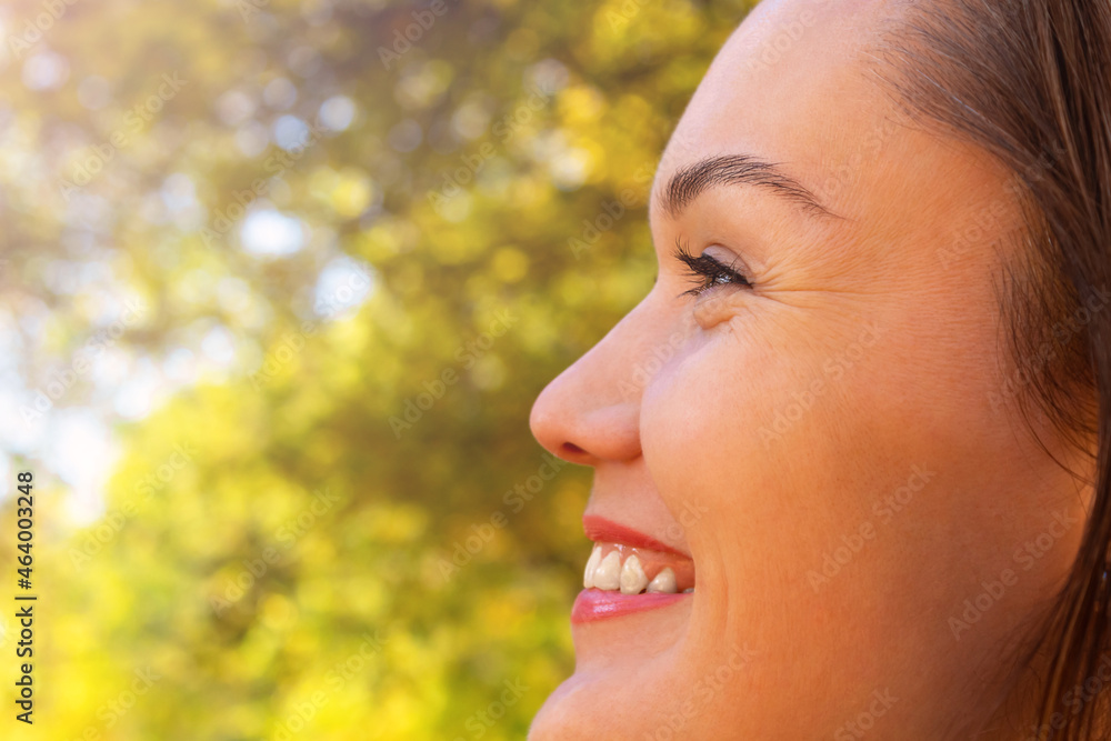 Woman close up portrait. Nature. Autumn. Profile. Woman close up portrait. Nature. Autumn. Profile.