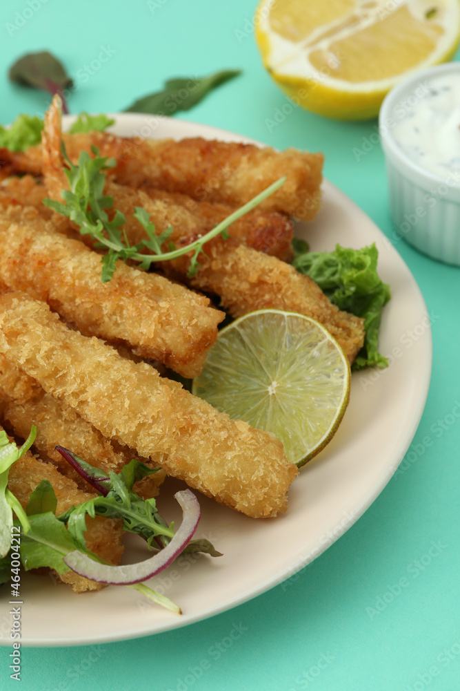 Сoncept of tasty food with deep-fried shrimp on mint background Сoncept of tasty food with deep-fried shrimp on mint background